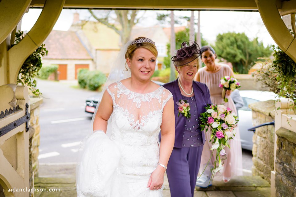 bride arrives at harmston church wedding photo
