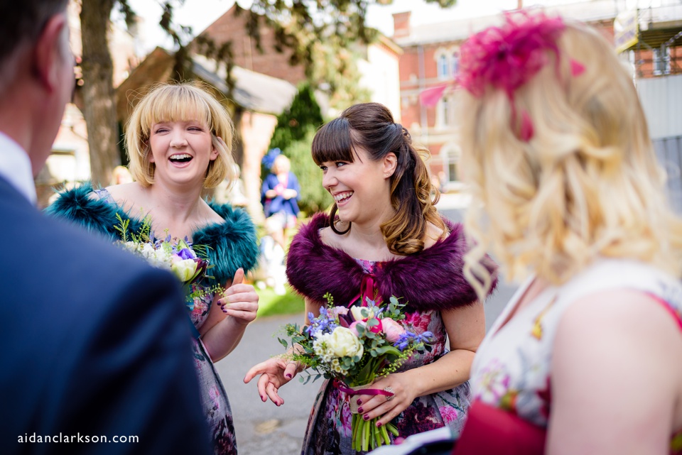 this is a photo of a bridesmaid laughing