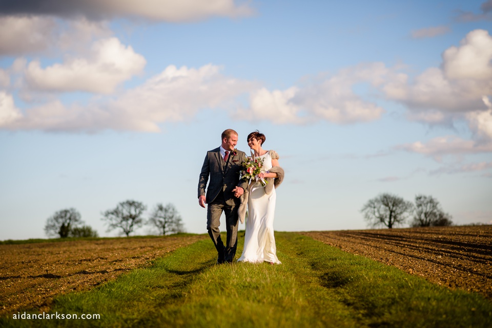 bride and groom photos in a field in summer