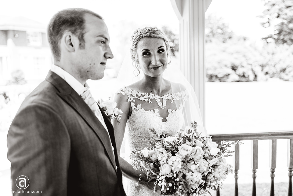 A kenwick park bride and groom looking at each other in a black and white wedding photo.