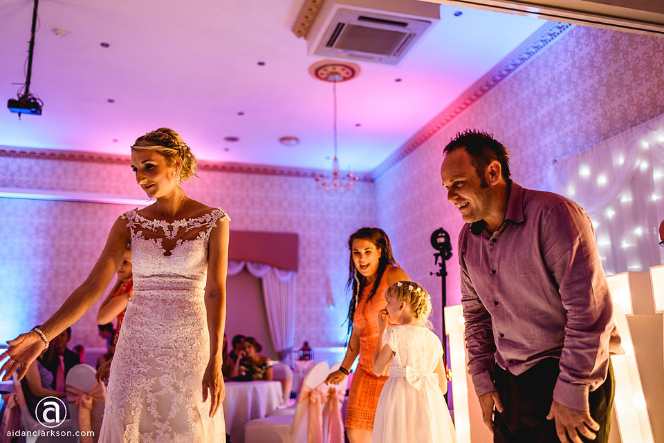 A wedding reception at Kenwick Park with a bride and groom standing on the dance floor.