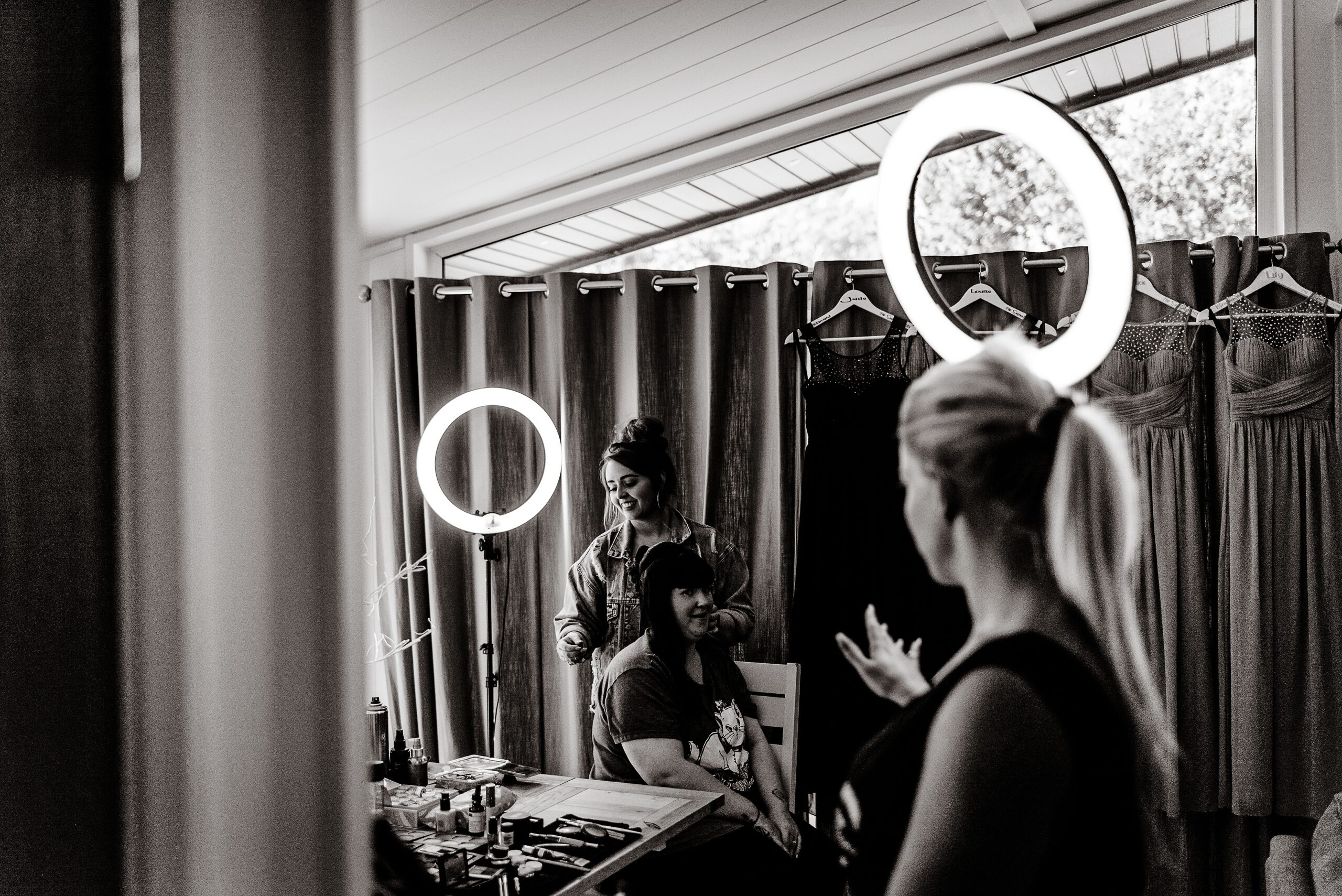 A woman is getting ready in front of a mirror at Laceby Manor.