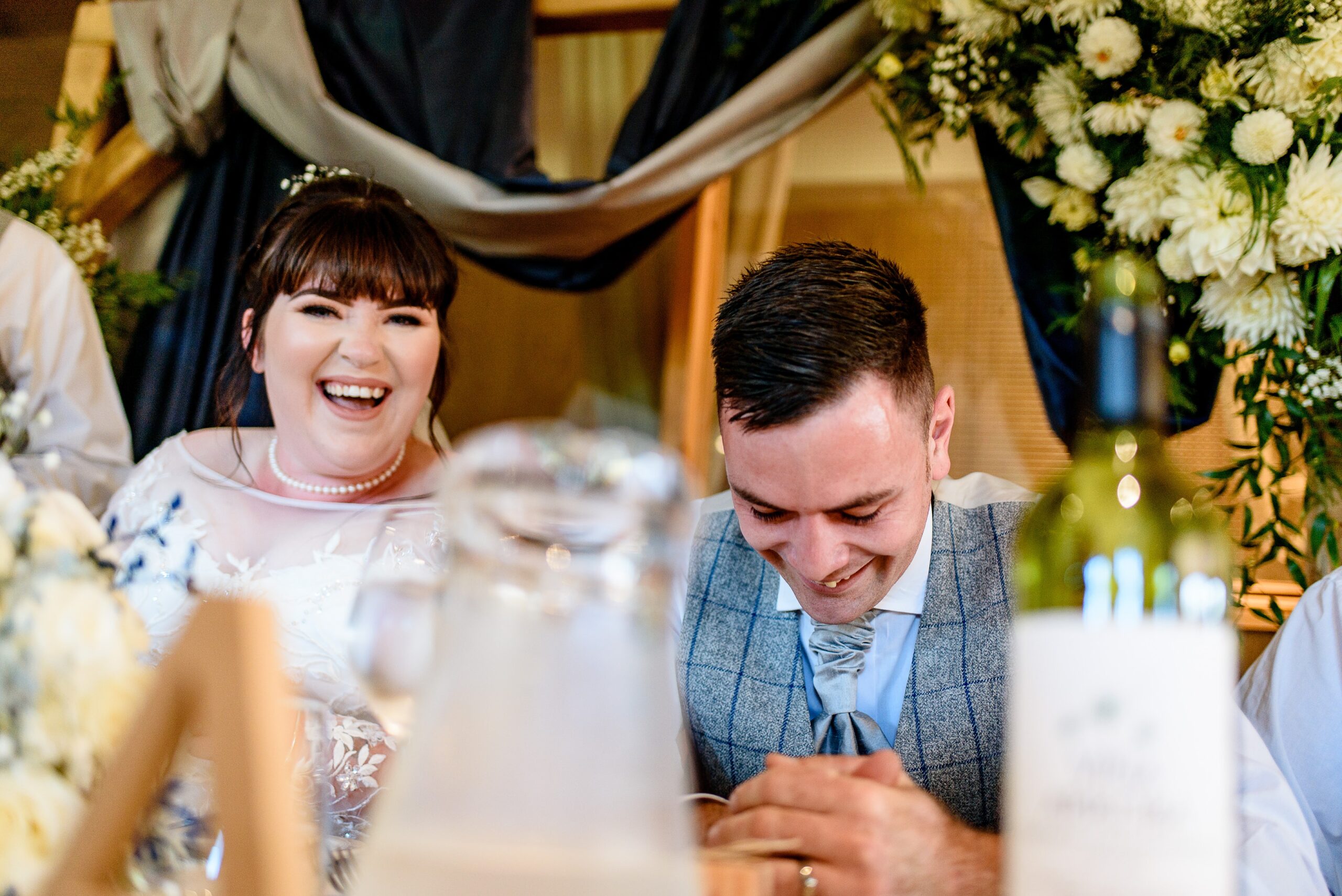 A bride and groom signing their wedding vows at Laceby Manor.