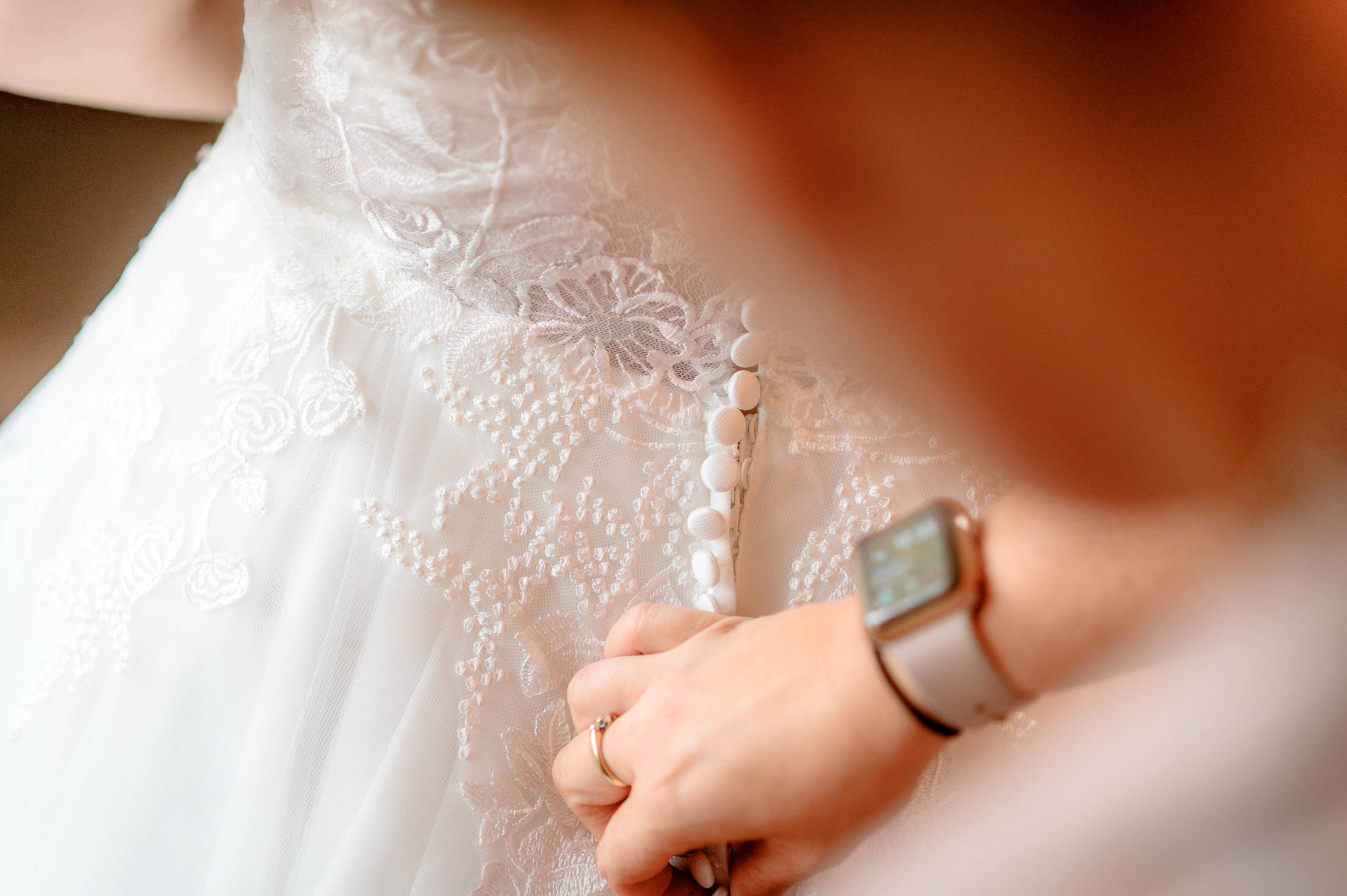 A woman is trying on a wedding dress at the Brackenborough Hotel.