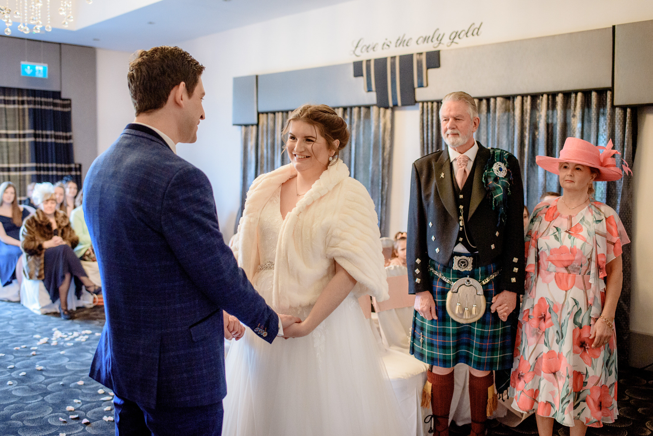 A bride and groom exchange vows at Brackenborough Hotel wedding.