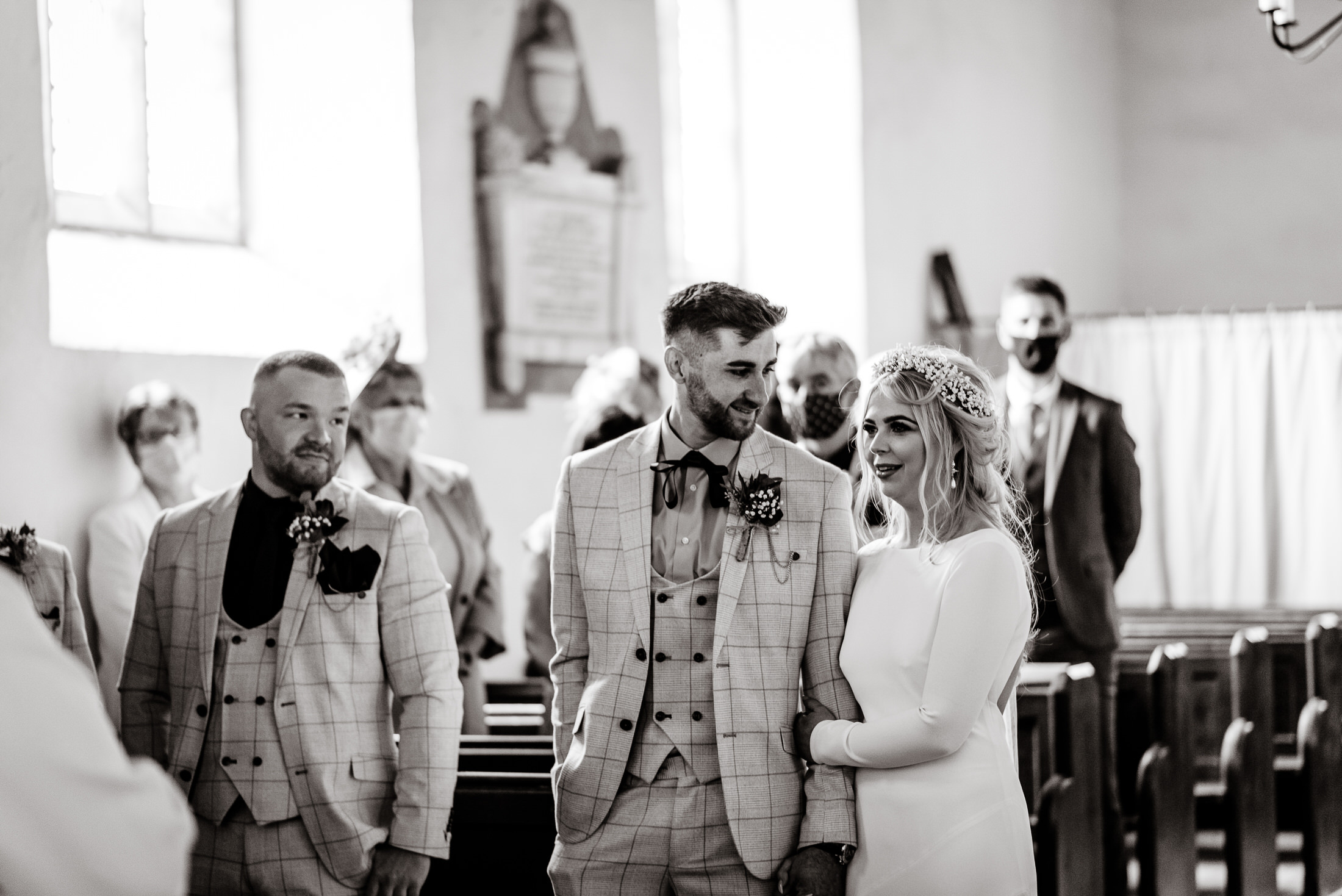 Wedding photo of bride and groom in a church.