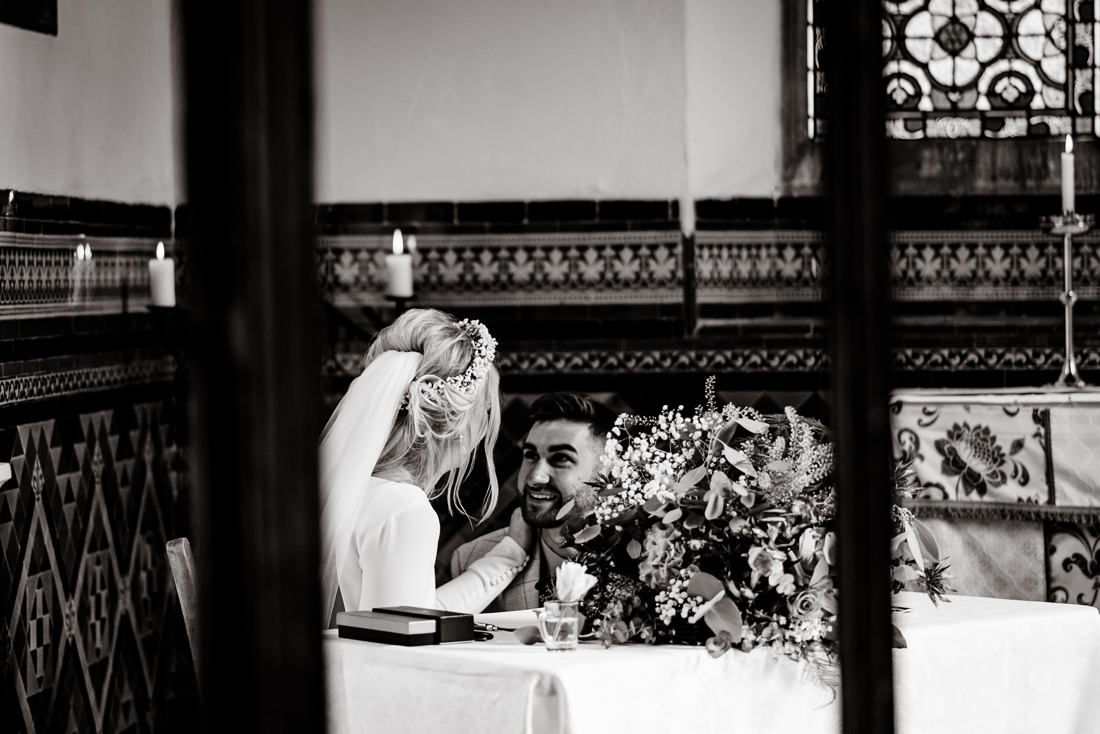 A bride and groom celebrating their wedding in the serene ambiance of Scrivelsby Walled Garden.