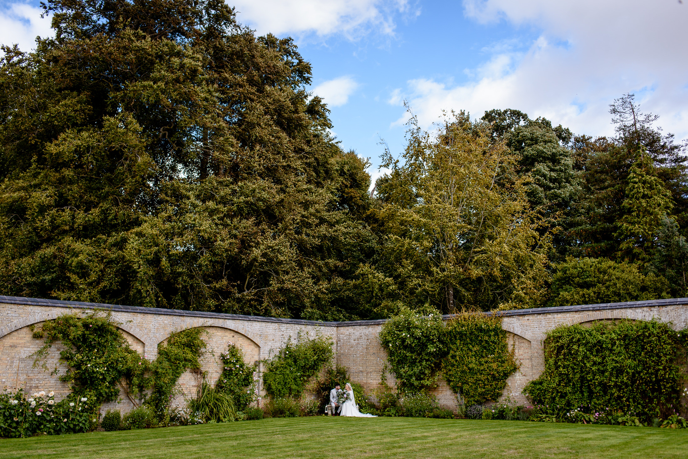 A wedding couple standing in the Scrivelsby Walled Garden.