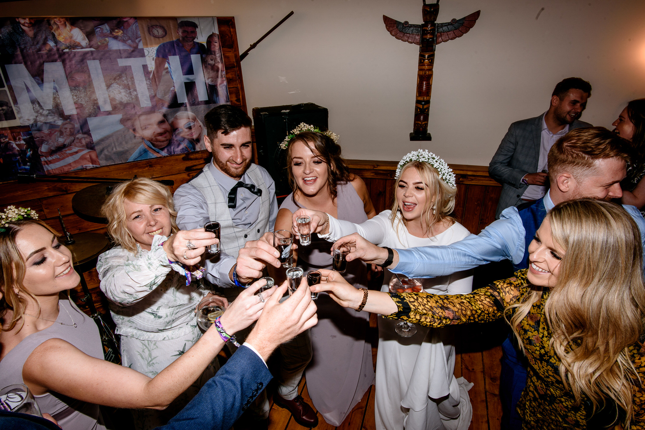 A group of people toasting at a scrivelsby walled garden wedding reception.