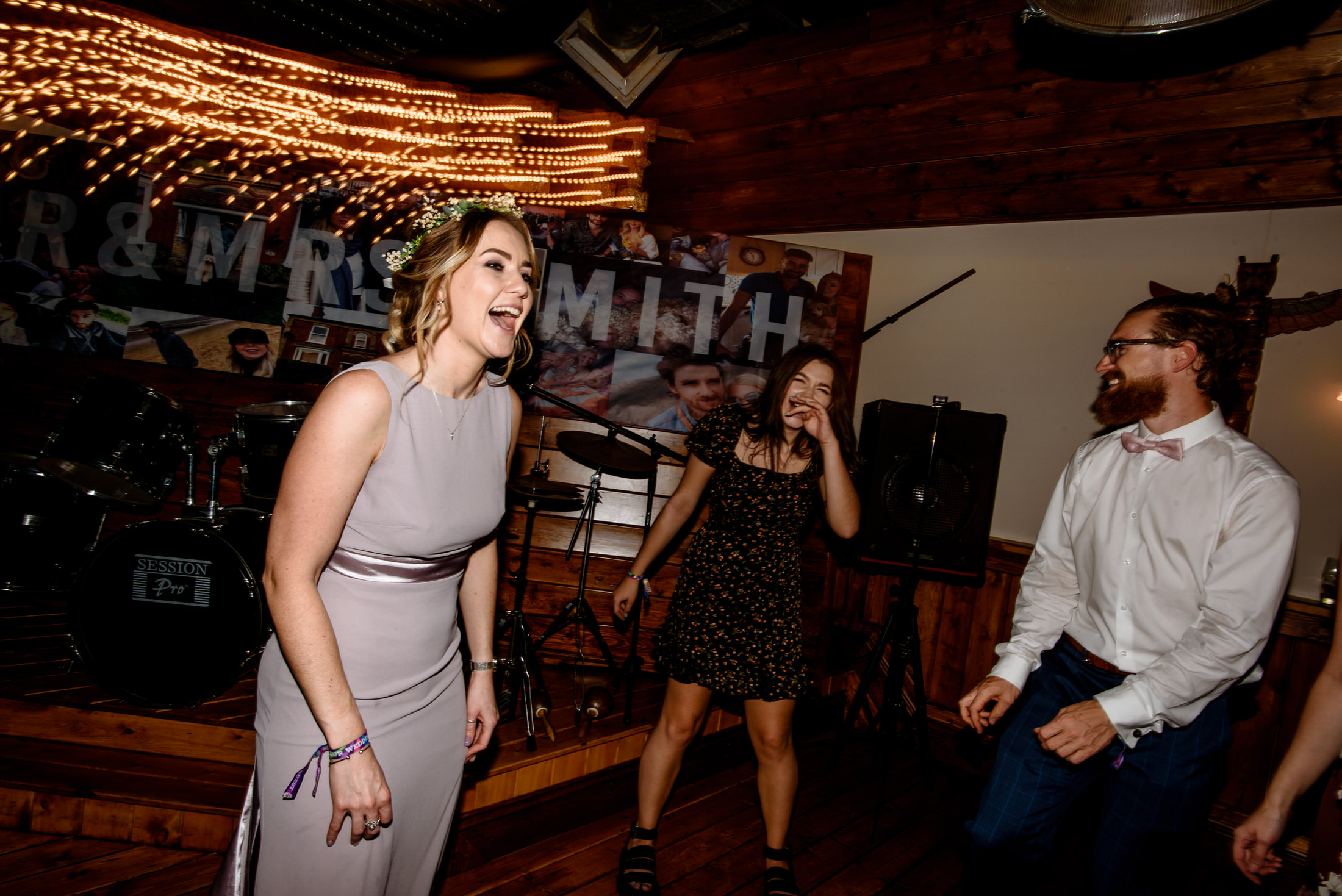 A lively scrivelsby walled garden wedding reception with a group of people joyfully dancing.